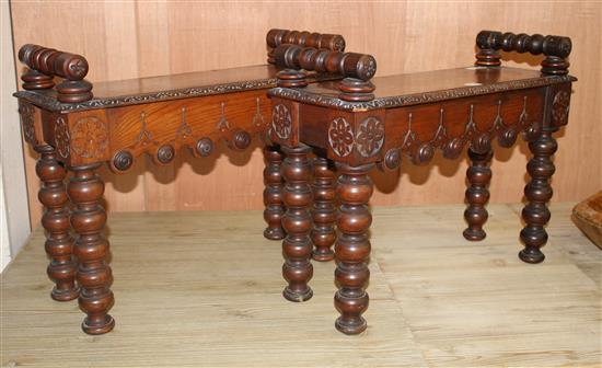 A pair of small late Victorian carved oak hall benches, W.65cm D.25cm H.50cm